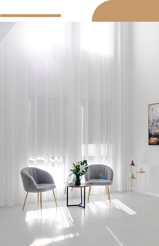 Minimalist seating area with large window and sunlight