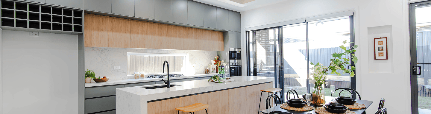 Modern kitchen with wood cabinets and large window