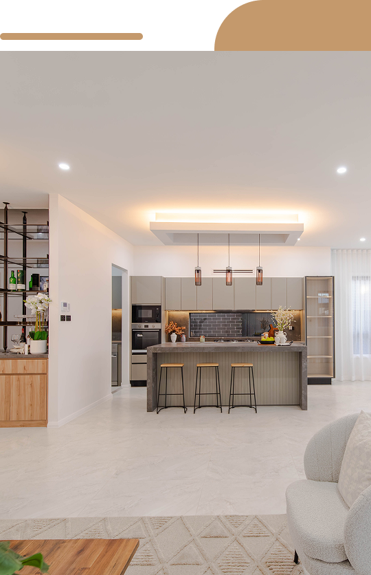 Open plan kitchen with wooden cabinets and marble island